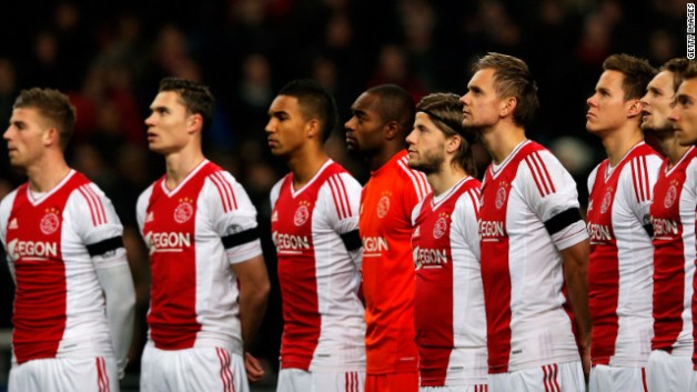 The most famous club in Dutch football, Ajax, pay their respects during a pre-match minute silence in memory of linesman and father, Richard Nieuwenhuizen. (Picture courtesy of CNN)